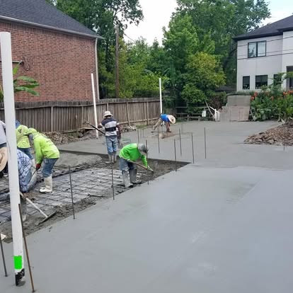 Workers finishing a concrete slab